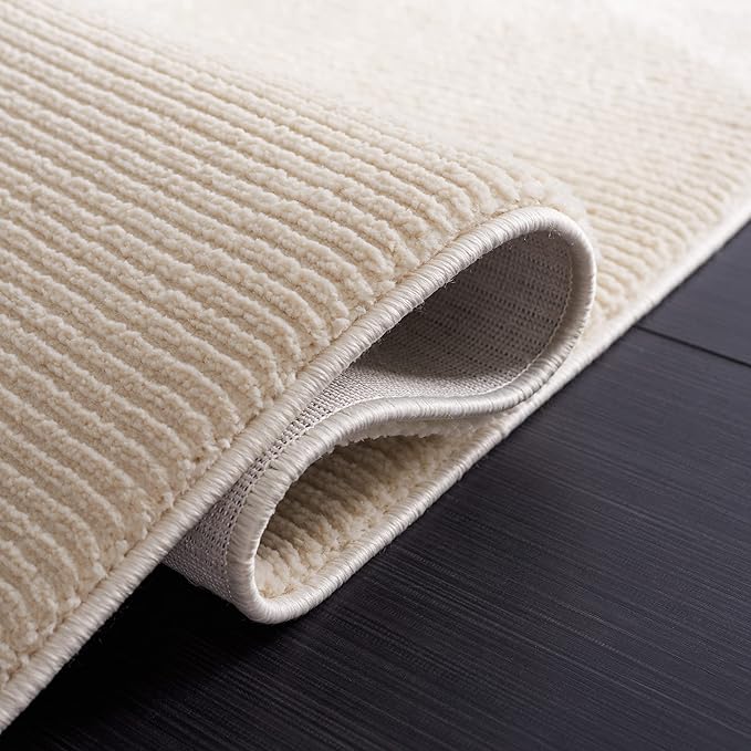 SAFAVIEH Revive Collection Area Rug - 6'7" x 9', Ivory, Solid Design, Ideal for The Living Room, Bedroom, Dining Room (REV102A-6)