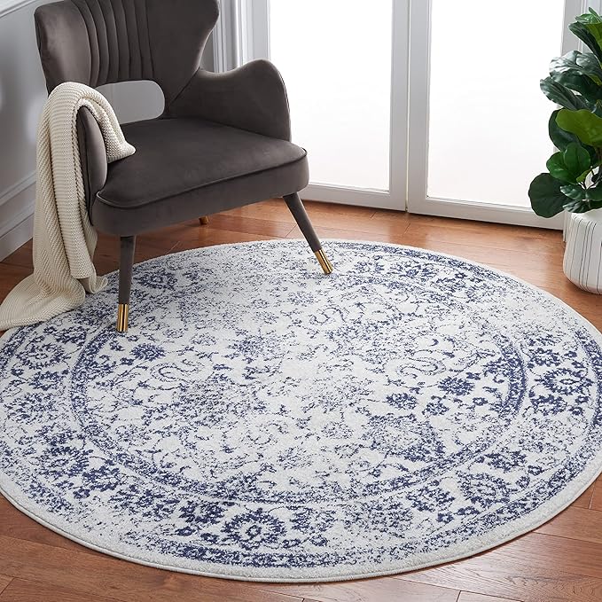 SAFAVIEH Adirondack Collection Area Rug - 10' Round, Ivory & Navy, Distressed Vintage Floral Design, Non-Shedding & Easy to Clean, Ideal for Living Room, Bedroom, Dining (ADR109M)
