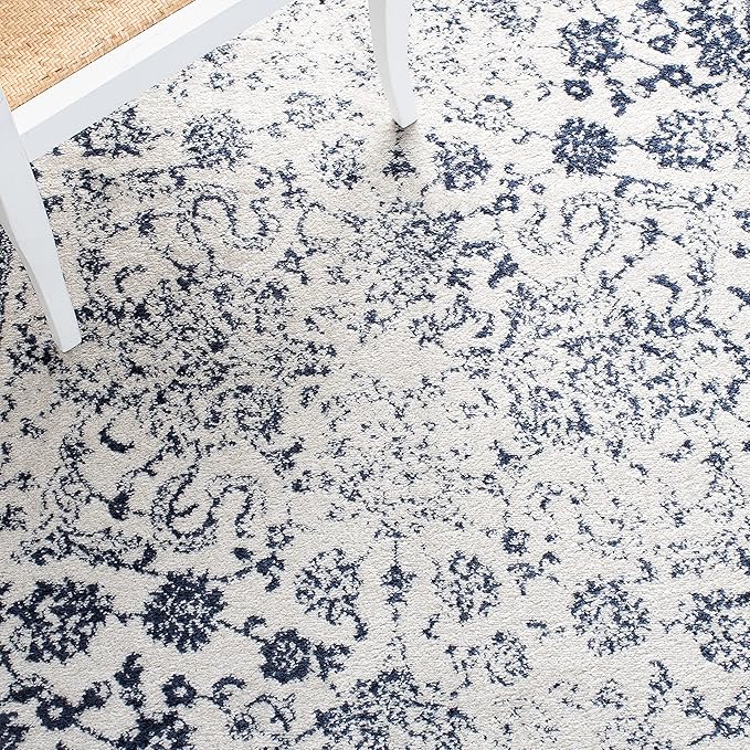 SAFAVIEH Adirondack Collection Area Rug - 5'1" x 7'6", Ivory & Navy, Distressed Vintage Floral Design, Non-Shedding & Easy to Clean, Ideal for Living Room, Bedroom, Dining Space (ADR109M)