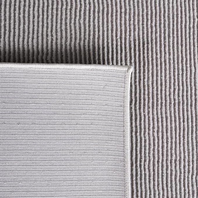 SAFAVIEH Revive Collection Area Rug - 5'3" x 7'7", Grey, Solid Design, Non-Shedding & Easy Care, Ideal for High Traffic Areas in Living Room, Bedroom (REV102F)